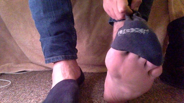 Removing my stinky Magnum boots and sweaty no-show socks