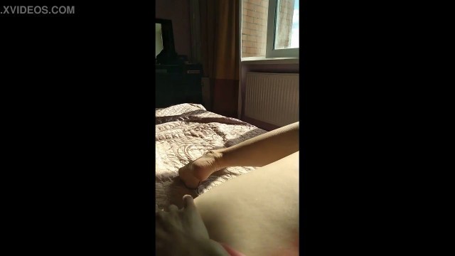 POV female masturbation, horny milf relaxes and gently masturbates her clitoris, the rays of the sun fall on her unshaven pussy 